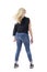 Blond healthy hair motion of middle aged woman while dancing carefree. Back view