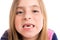 Blond indented girl showing teeth funny portrait