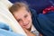 Blond kid girl tired relaxed smiling indented