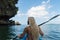 Blond Lady in the kayak in  calm tropical bay Thailand sea