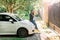 Blond pretty woman with smart phone and car keys next to her car. Outdoor. Young business woman is happy and enjoying