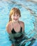 Blond russian preteen girl in swimming pool