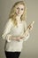 Blond teen holding wooden recorder