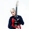 Blond Tomboy girl with electro guitar. Rock style fashion