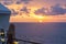 Blond watching sunset from cruise ship in caribbean sea near Phi