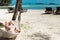 Blond woman asleep in a hammock.