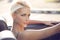 Blond woman in cabrio