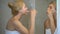 Blond woman carefully brushing teeth, morning procedure, dental care whitening