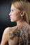 Blond woman and dragon tattoo