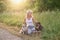 Blond woman with her two dogs in the countryside