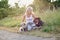 Blond woman with her two dogs in the countryside