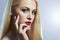 Blond woman with manicure.Beautiful girl model with make-up