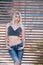 blond woman with perfect flat stomach lean on partition walls