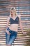 blond woman with perfect flat stomach lean on partition walls