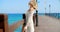 Blond Woman on Pier and Looking Back Over Shoulder