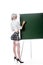 blond woman in seductive school uniform and stockings writing on empty chalkboard