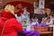 Blond woman shops cosmetics packed in cellophane