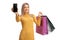 Blond woman showing a mobile phone and carrying shopping bags