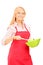 Blond woman wearing red apron and holding kitchen utensil