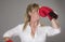 Blond woman wearing red boxing gloves