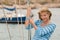 Blond young woman on sailing boat