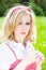 Blonde beautiful girl portrait with dandelion