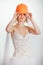 Blonde bride in helmet and wedding dress