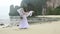 Blonde Bride Long Haired Turns Round Barefoot with Veil