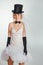 Blonde bride in tophat with veil and long black gloves