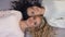 Blonde and brunette women with amazing curly hair lying on floor, shampoo