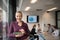 Blonde businesswoman working on tablet at office