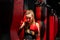 Blonde Caucasian fighter girl punching actively. Practicing in red Boxing Gloves
