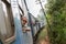 Blonde caucasian woman riding a train, looking trough window.