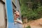 Blonde caucasian woman riding a train, looking trough window.