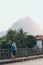 Blonde Caucasian woman walking on the bridge at sunset in Nong Khiaw, Laos