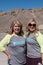 Blonde females mother and daughter pose for a photo at scenic overlook - Zabriskie Point in Death Valley National Park