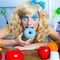 Blonde funny girl on kitchen eating blue dona