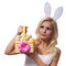 Blonde girl with easter basket isolated on white.