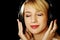 Blonde girl in headphones with eyes closed