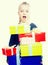 blonde girl holding in hands lots of boxes with gifts on isolated background