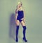 Blonde girl with long legs and black stockings