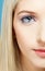 Blonde girl\'s half-face portrait