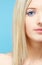 Blonde girl\'s half-face portrait