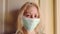 Blonde girl with sanitary mask