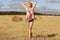 Blonde girl in sloping field