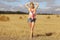 Blonde girl in sloping field