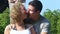 Blonde Girl and Strong Handsome Guy Sitting on Longtail Boat