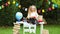 Blonde girl a student in a school uniform on the school Desk waving and laughing