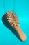 Blonde hair loss problem with hairbrush on blue background. Flying concept.