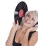 Blonde in headphones with vinyl record over white